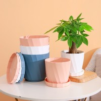 廠家直銷簡約創(chuàng)意仿瓷塑料花盆圓形加厚大號(hào)花盆樹脂塑料套裝批發(fā)